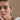 Costa Mini Gold shell hoop earrings by Georgie Quinn on model